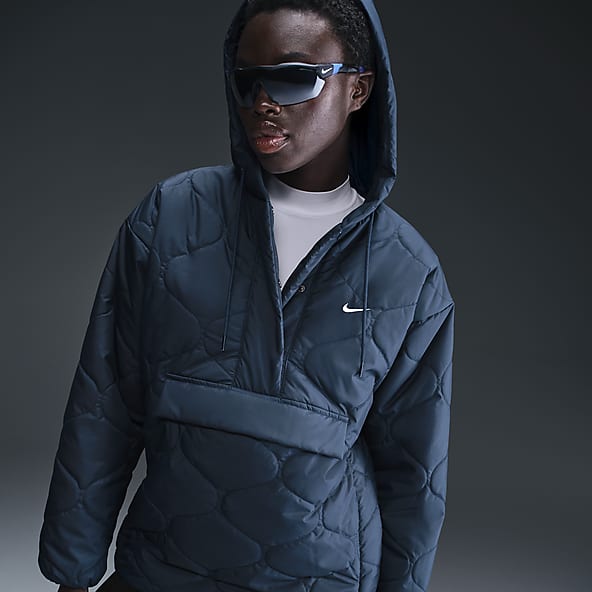 Blauw Jassen en bodywarmers. Nike NL